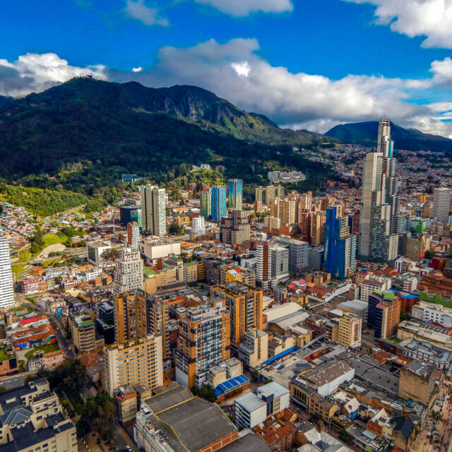 Bogota cityscape of big buildings and mountains and blue sky