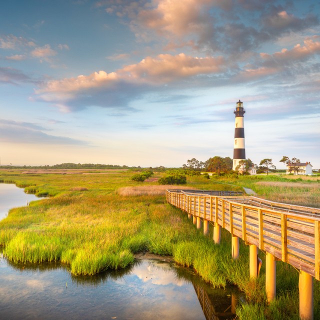 Part of the beautiful Cape Hatteras National Seashore, the Bodie Island Lighthouse is an Iconic Lighthouse of Nags Head Outer Banks North Carolina. This incredible stretch of coastal barrier islands along the east coast of NC is known for its amazing beaches and abundant wildlife.