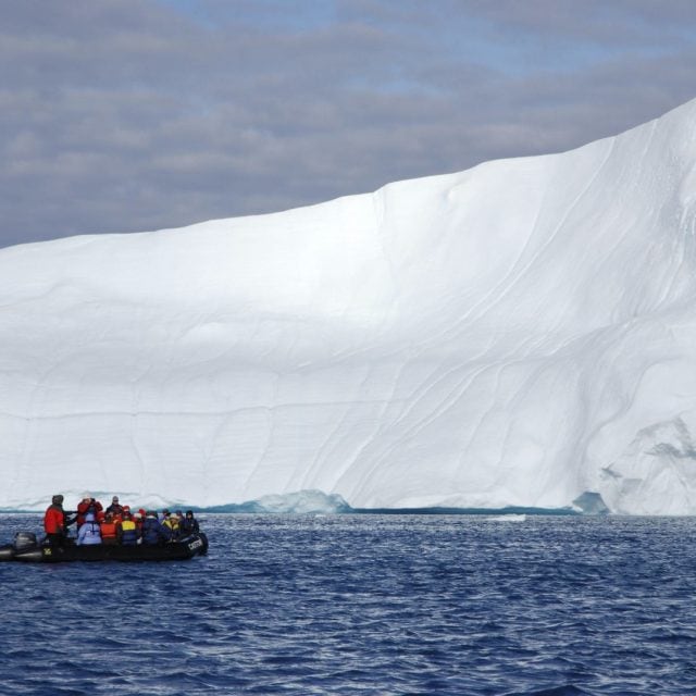 zodiac beside iceberg