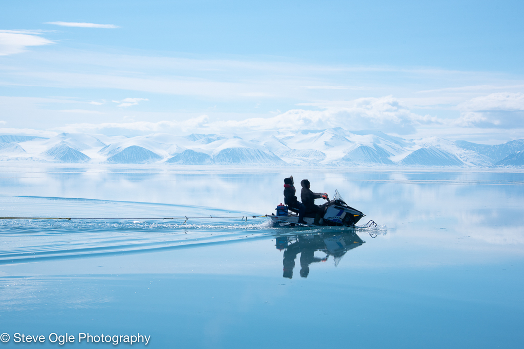 Snowmobile traveling on sea ice