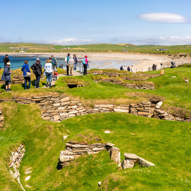Orkney, Scotland - People visiting the stone remains of the Neolithic village of Skara Brae, on the Orkney coast.